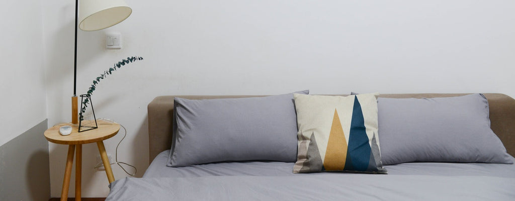 Woman sleeps in white bed